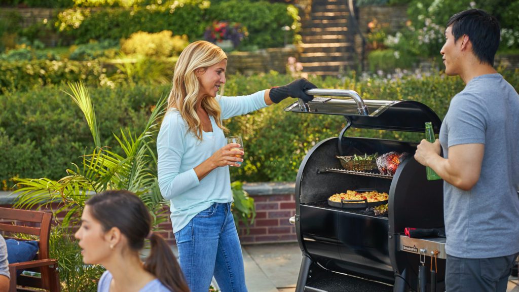 woman grilling dining al fresco grilled dinner