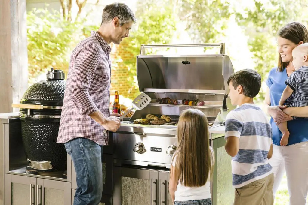 Family around grill-Synergy Outdoor Living