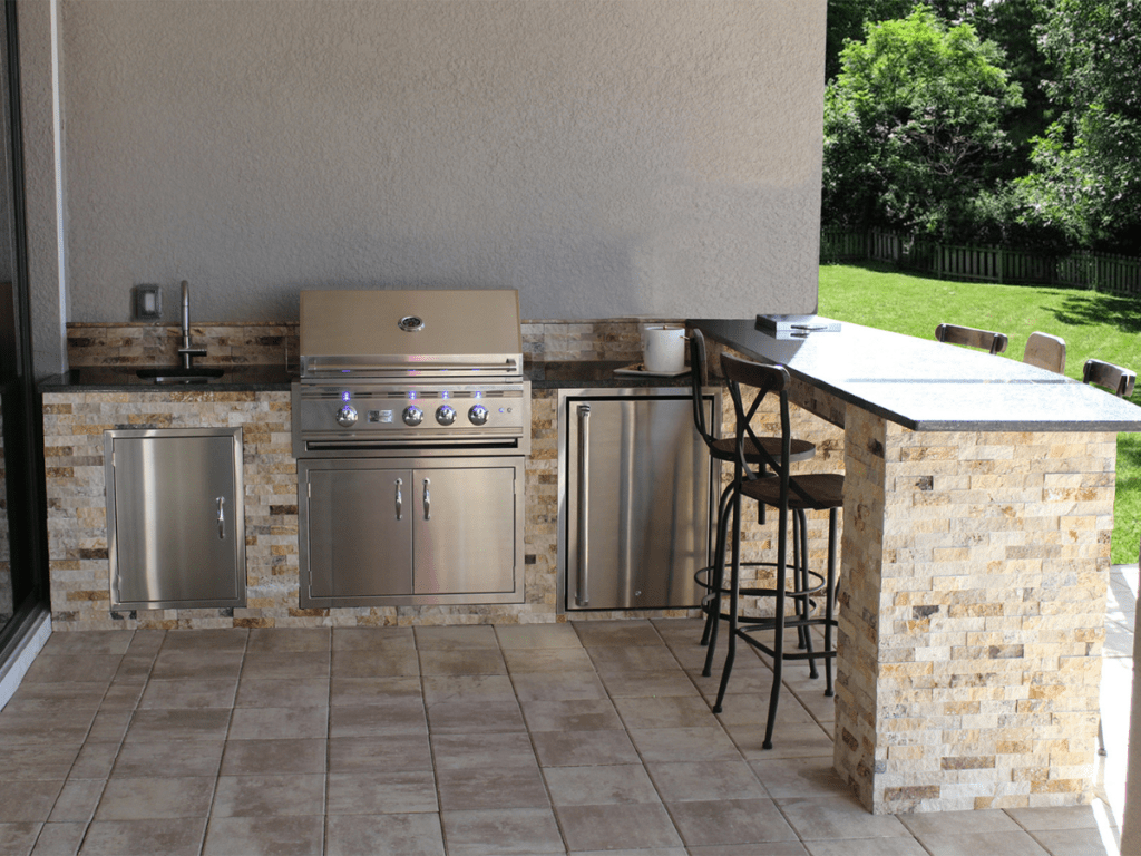 Stainless steel L-Shaped Kitchen by Synergy Outdoor Living