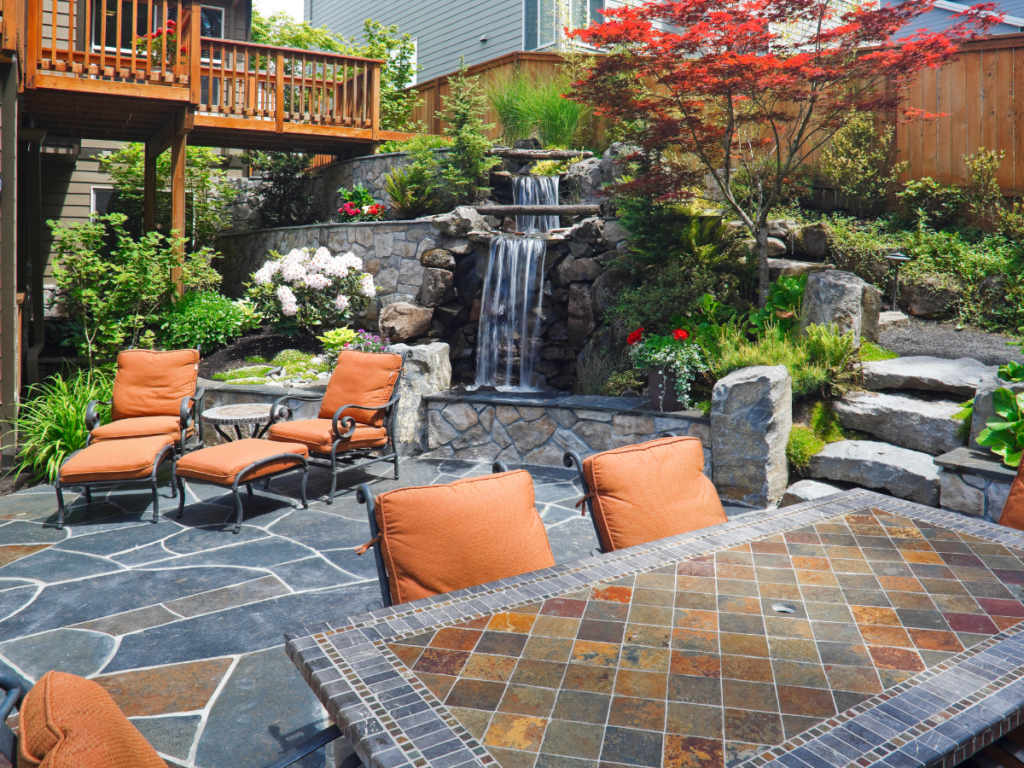 orange patio furniture in outdoor living space Synergy Outdoor Living 