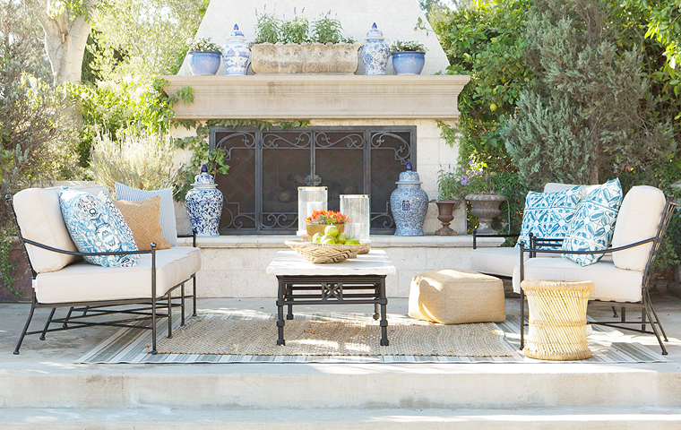patio furniture on patio with table and blue pillows 