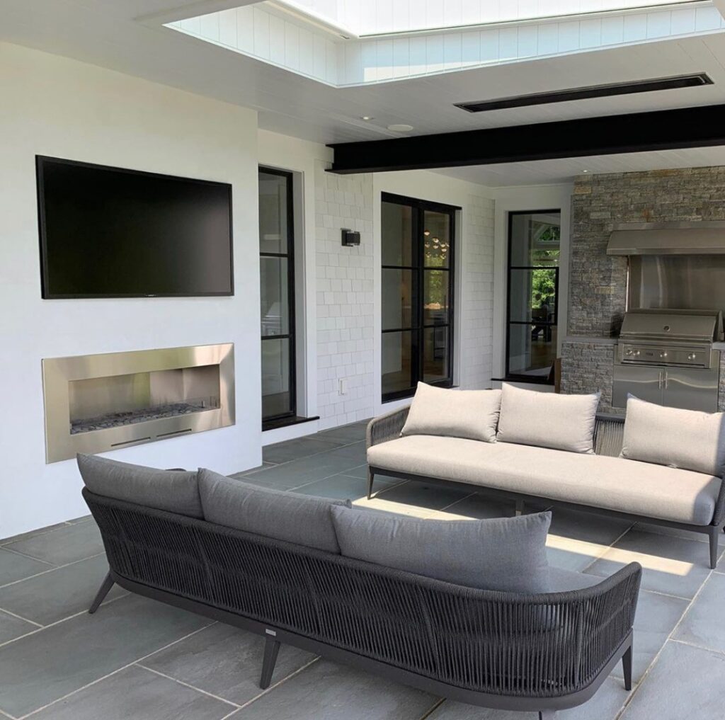 Outdoor TV flush-mounted into patio wall Synergy Outdoor Living 
