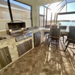 outdoor kitchen with grill and refrigeration in Apollo Beach Florida