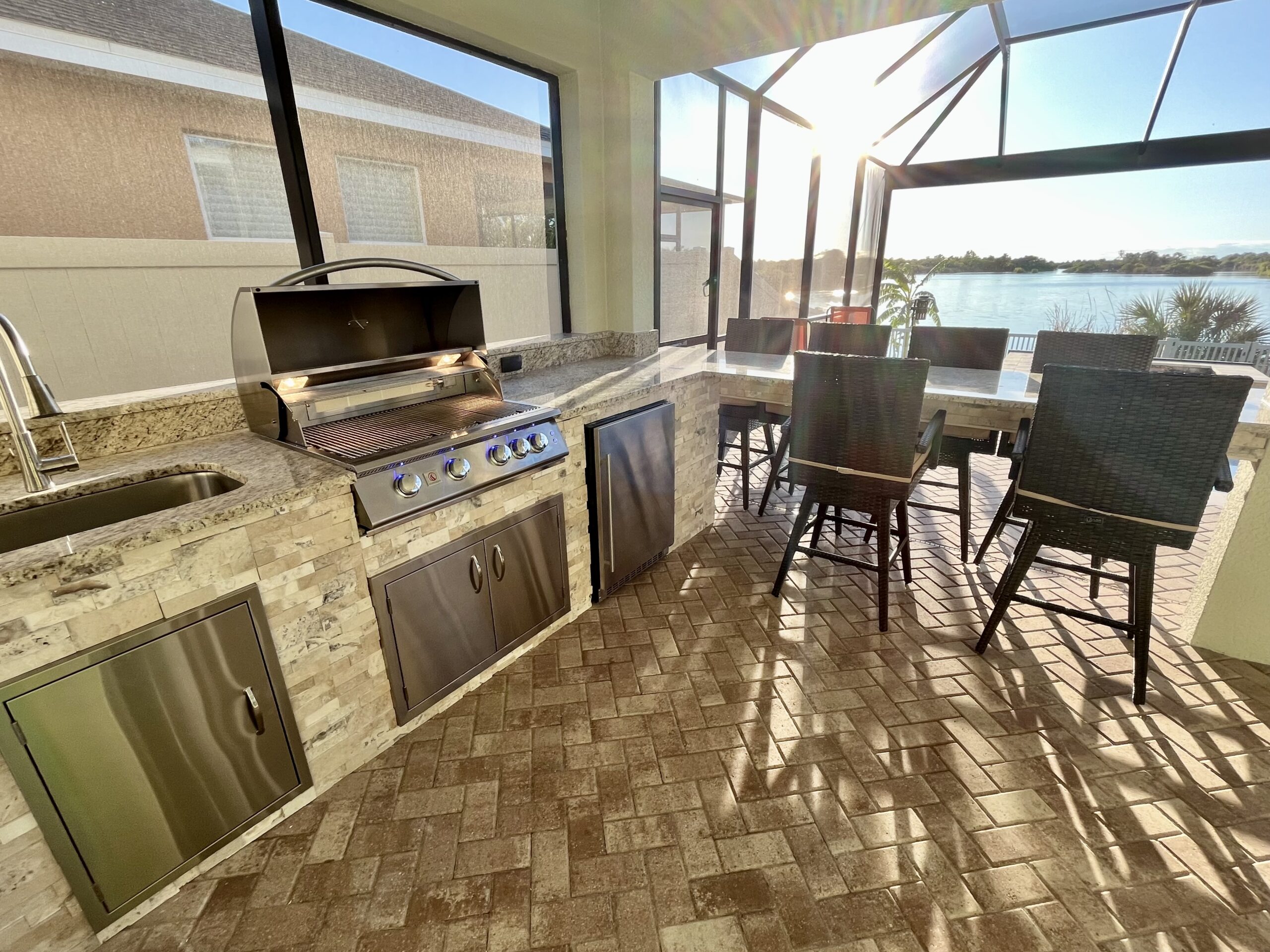outdoor kitchen with grill and refrigeration in Apollo Beach Florida