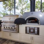 custom outdoor kitchen with pizza oven and Endura cabinets