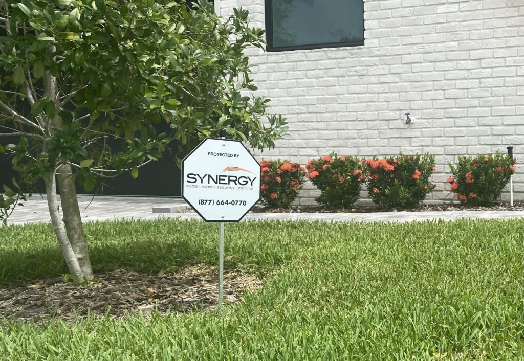 Synergy FL security sign in front yard 