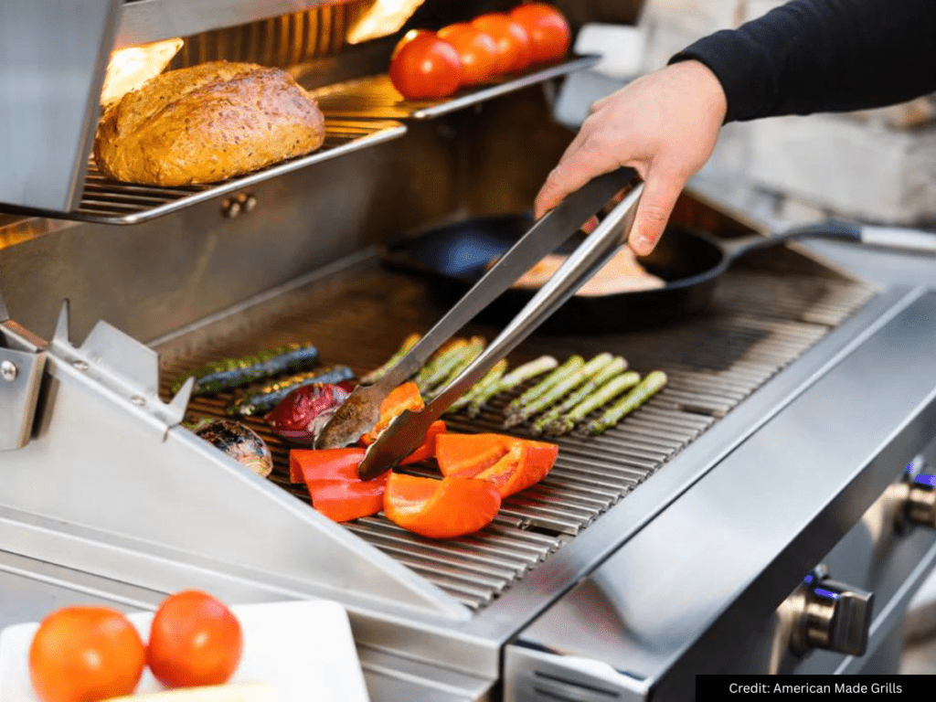 Person cooking vegetables on Atlas grill by American Made Grills 