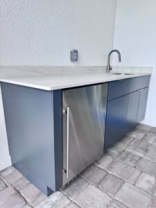 Minimalist outdoor kitchen with fridge and sink