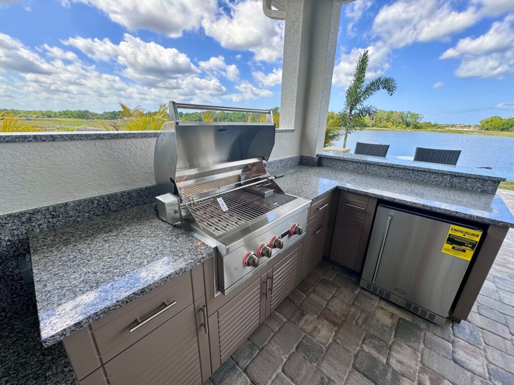 custom outdoor kitchen with stainless steel appliances 
