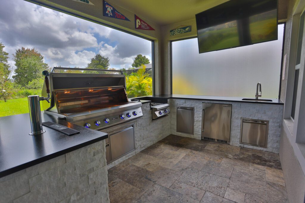 kegerator installed on kitchen counter in outdoor kitchen space 